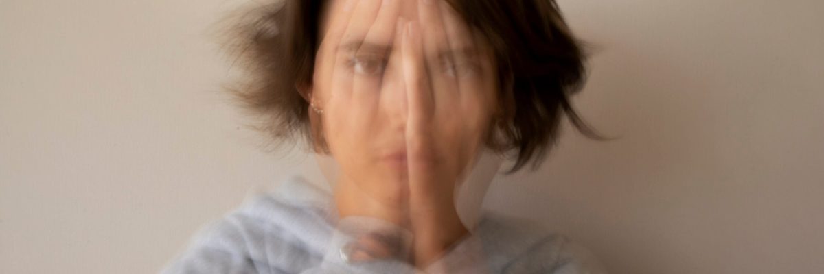 blurry-woman-dealing-with-anxiety-front-view