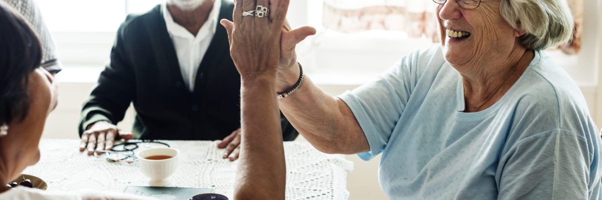 Senior women giving each other high five