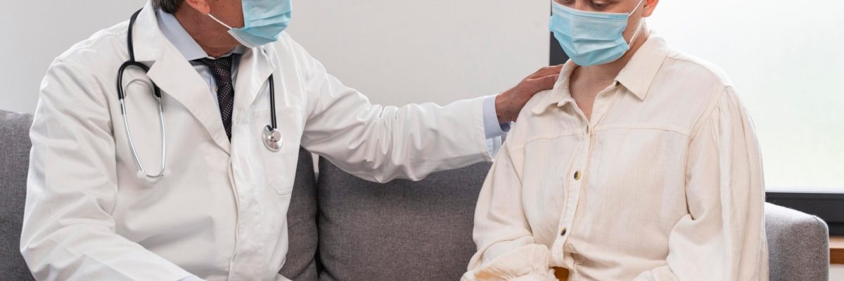young-woman-suffering-breast-cancer-talking-with-her-doctor